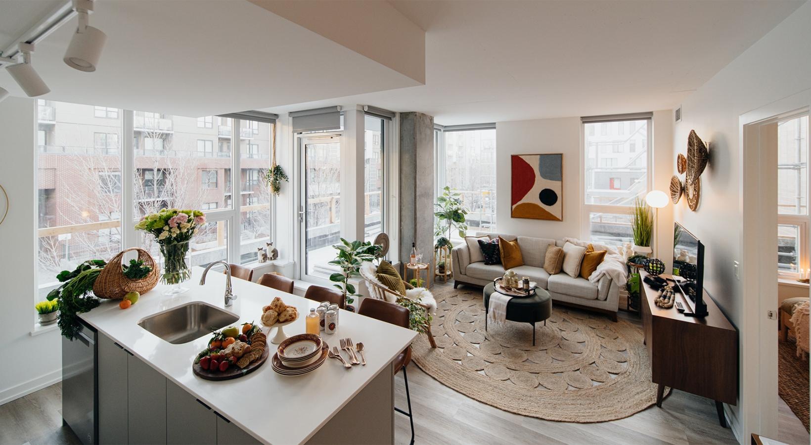 a living room with a large kitchen