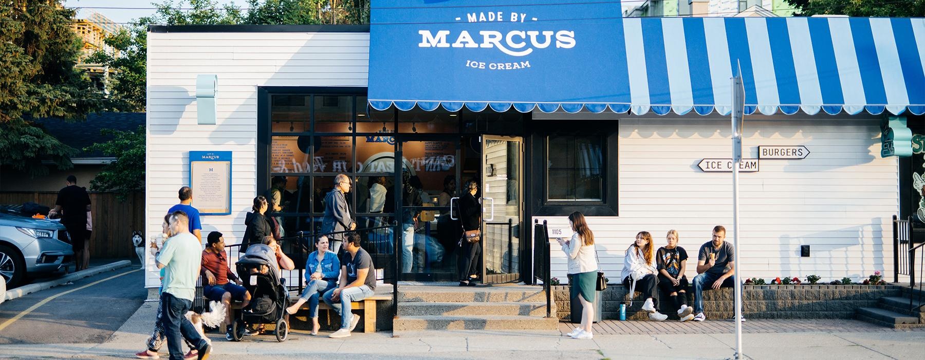 a group of people sitting outside a store